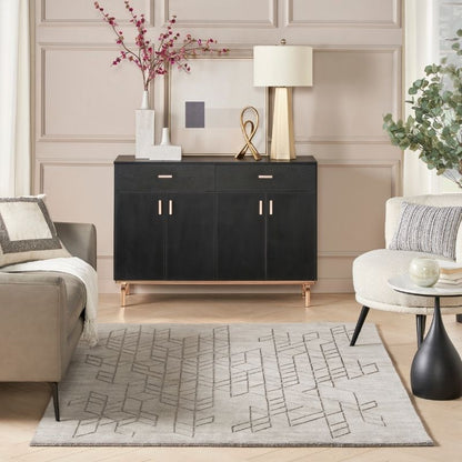 Modern living room with a black sideboard, gray sofa, and decorative elements.