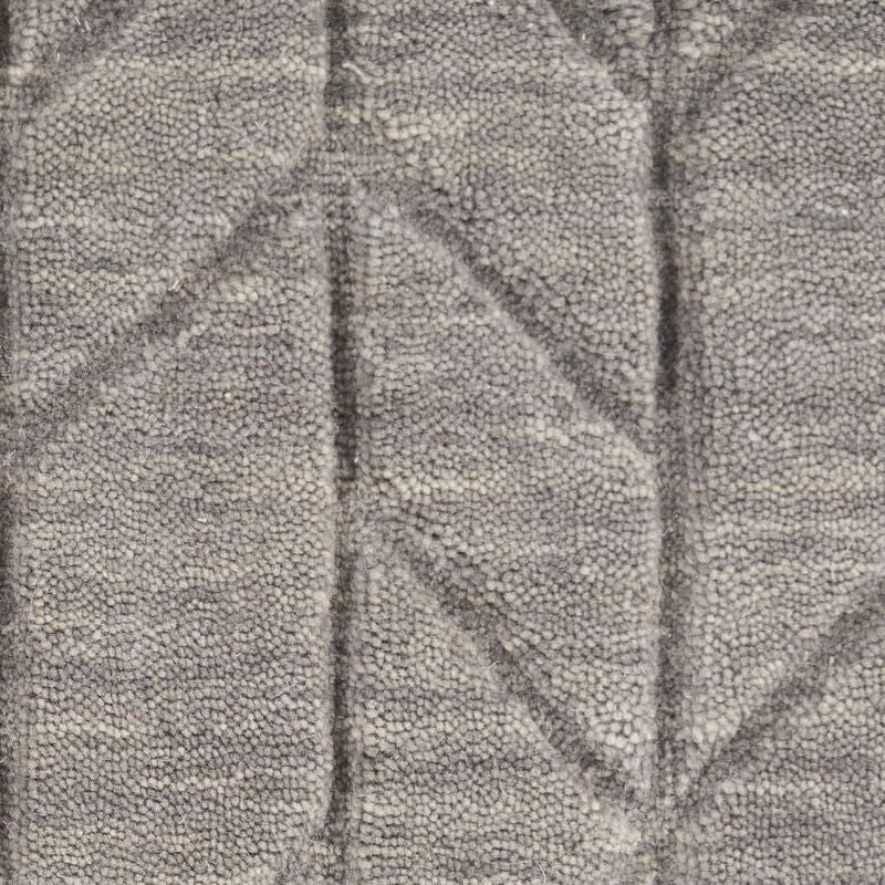 Close-up of textured gray fabric with leaf pattern