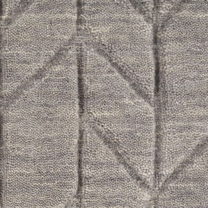 Close-up of textured gray fabric with leaf pattern