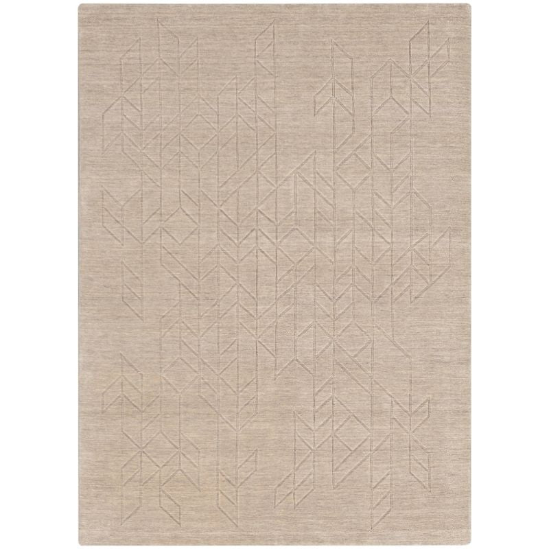 A rectangular area rug in a light beige or taupe color, featuring a subtle, low-contrast geometric pattern of interlocking triangles and lines woven across the surface.