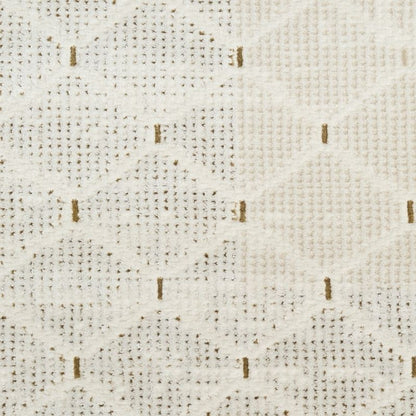 A close-up of a textured fabric with a cream and off-white woven pattern featuring small vertical brown stitched accents.