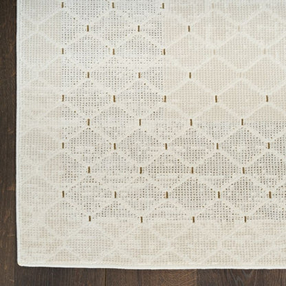 Textured white rug with a subtle pattern on a wooden floor