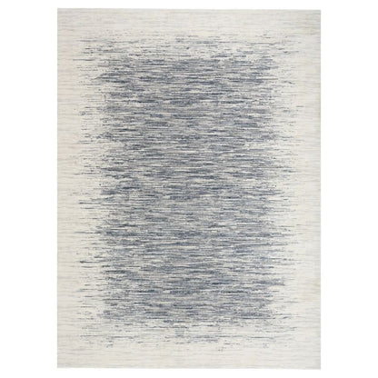 Rug with a gradient pattern transitioning from white to blue