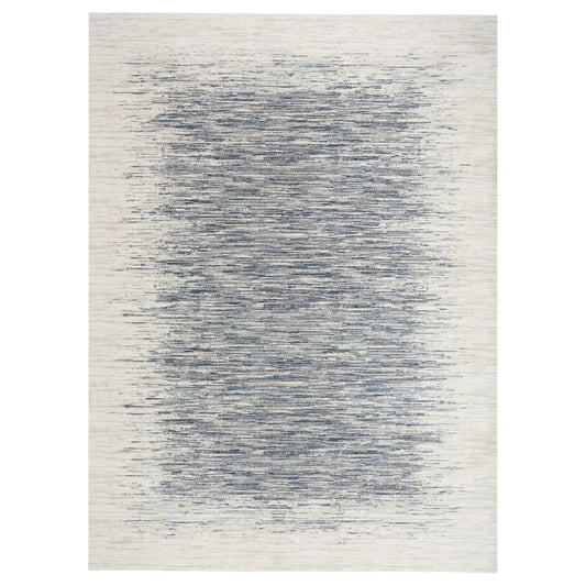 Rug with a gradient pattern transitioning from white to blue