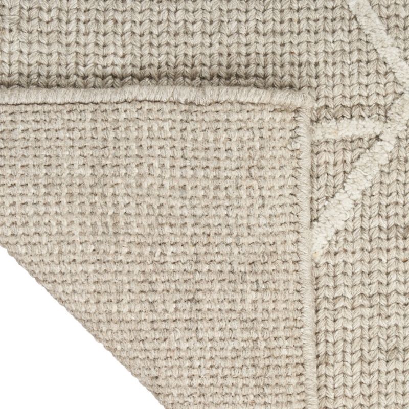 Close-up of a textured beige fabric with a checkered pattern