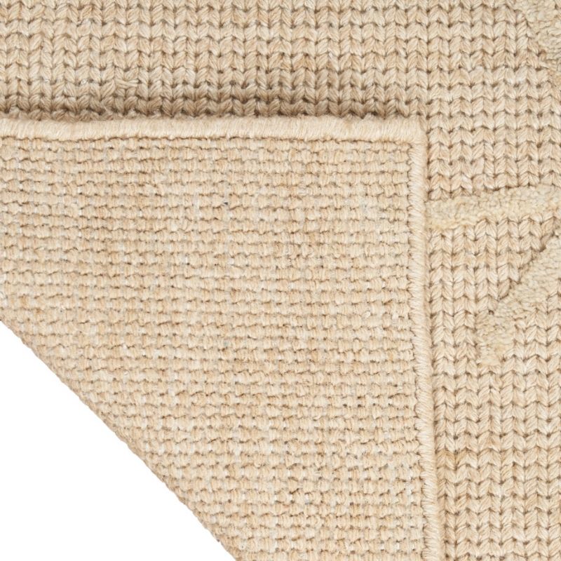 Close-up of a beige textured rug corner