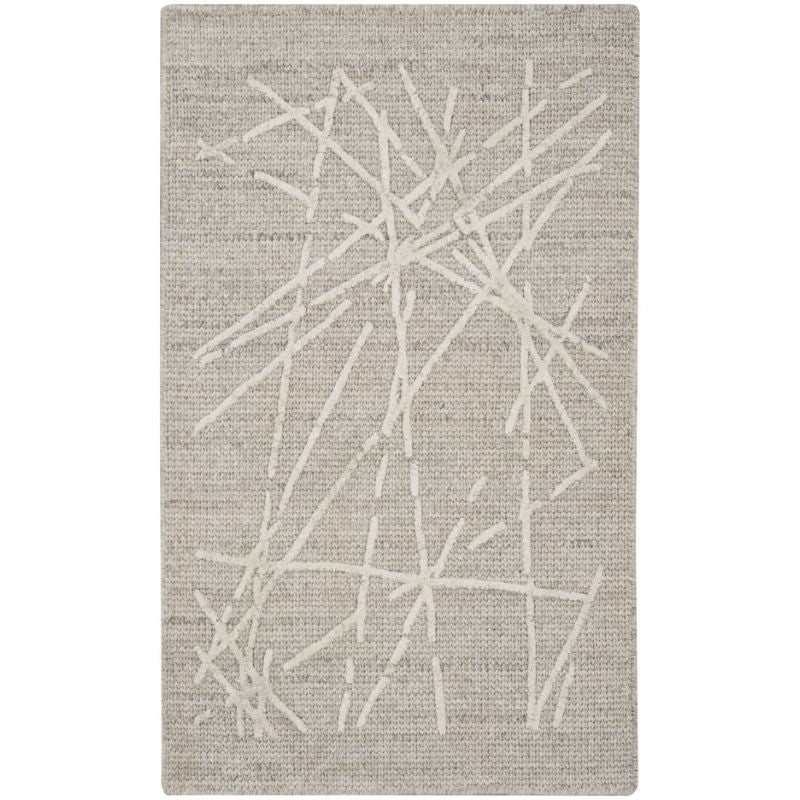 A rectangular area rug with a textured beige and off-white abstract design featuring intersecting linear patterns.