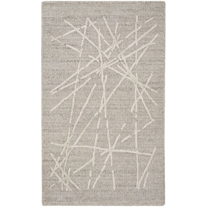 A rectangular area rug with a textured beige and off-white abstract design featuring intersecting linear patterns.