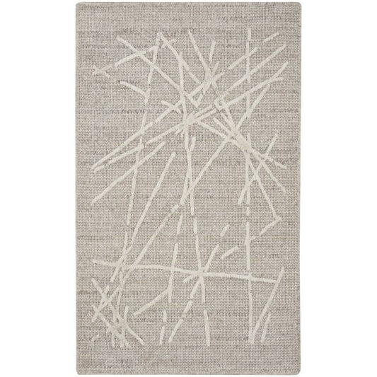 A rectangular area rug with a textured beige and off-white abstract design featuring intersecting linear patterns.