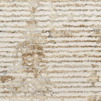 A close-up of a textured area rug with horizontal ribbed stripes in cream, beige, and light brown.