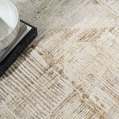 Close-up of a textured beige and brown carpet with a patterned design.