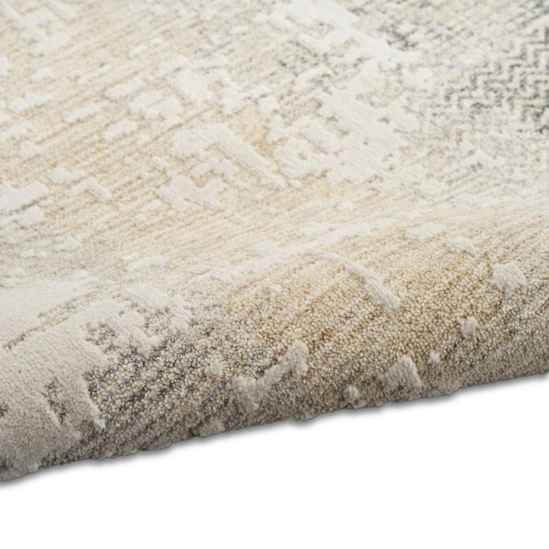 Close-up of a textured beige rug on a white background