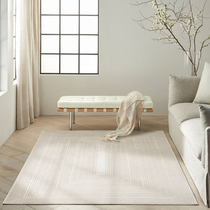 Modern living room with a beige rug, sofa, and bench.