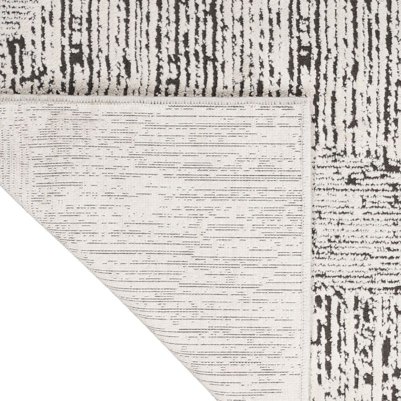 Close-up of a textured rug with a geometric pattern