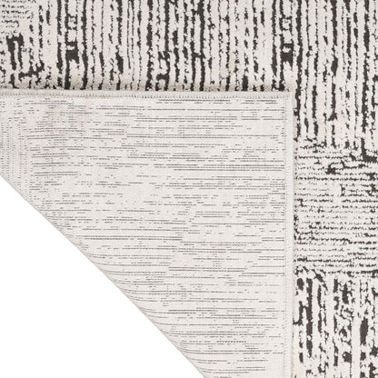 Close-up of a textured rug with a geometric pattern