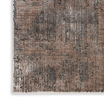 Textured area rug with brown and beige pattern on a white background