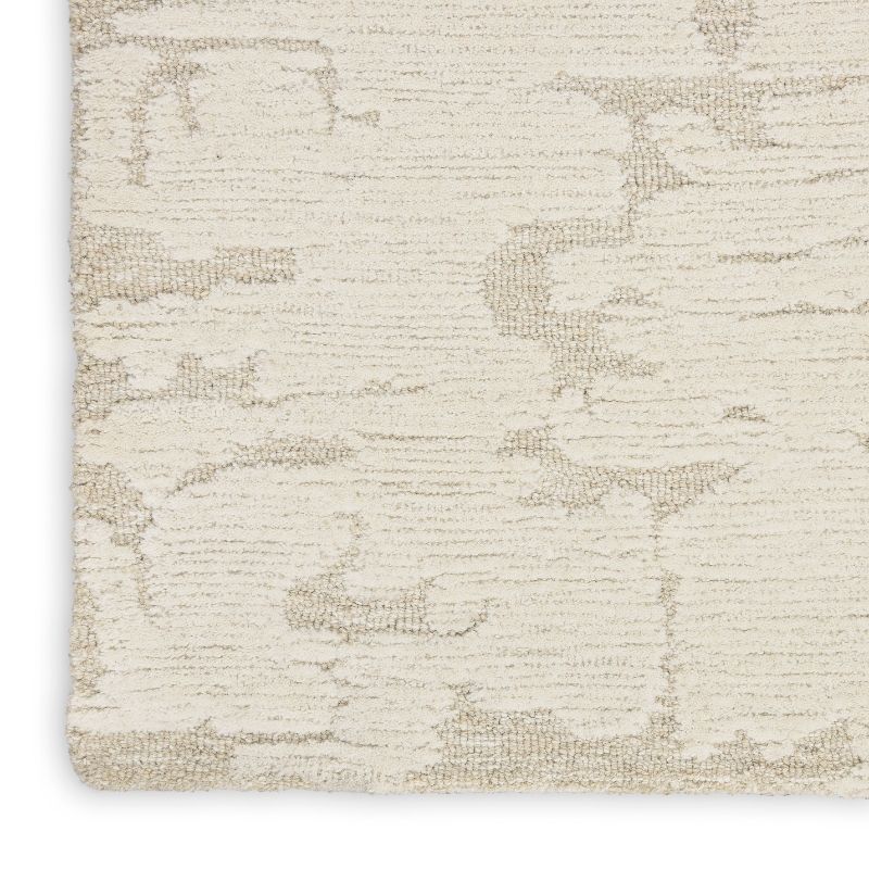 Textured beige rug with a subtle pattern on a white background