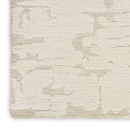 Textured beige rug with a subtle pattern on a white background