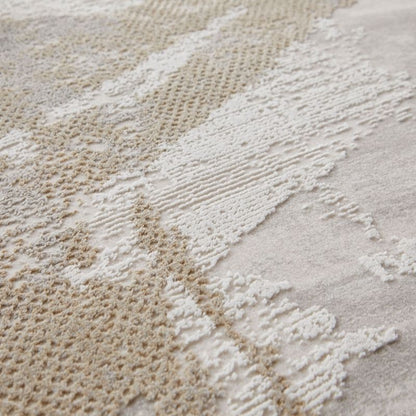 Close-up of a textured area rug with abstract organic patterns in cream, beige, and off-white, showing detailed pile variation.