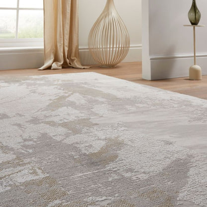 Textured area rug on a wooden floor with decorative elements in the background