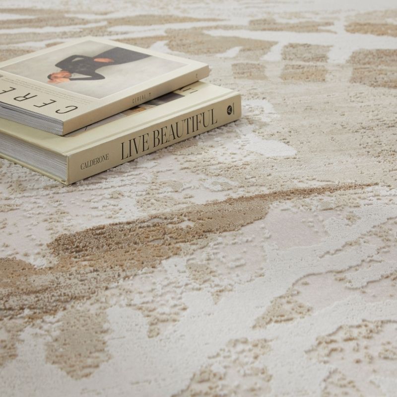 Two books titled 'Cerere' and 'Live Beautiful' on a textured surface.