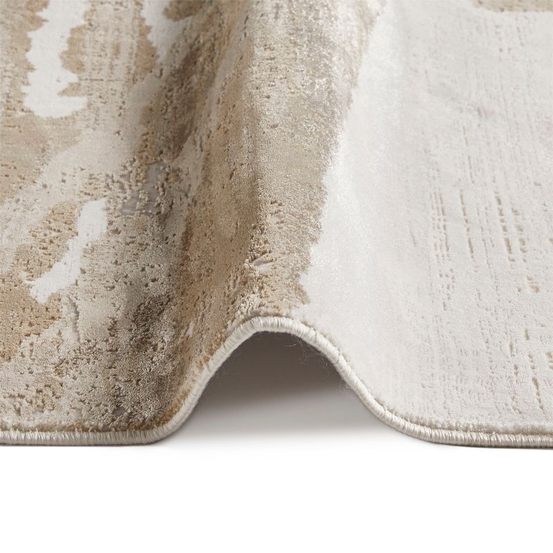 Close-up of a textured beige and white rug corner on a white background