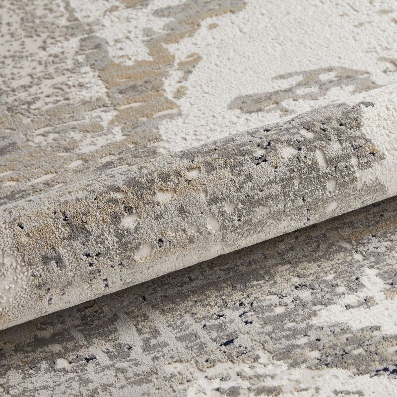 Close-up of a textured stone surface with a roll of stone-like material.