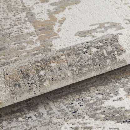 Close-up of a textured stone surface with a roll of stone-like material.