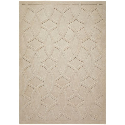 A rectangular area rug in a light beige or cream color, featuring a raised geometric trellis pattern of interlocking oval and diamond shapes.