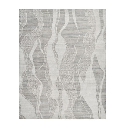 A square area rug with a modern abstract pattern of wavy vertical bands in light gray, medium gray, and off-white, showing a subtle woven texture.