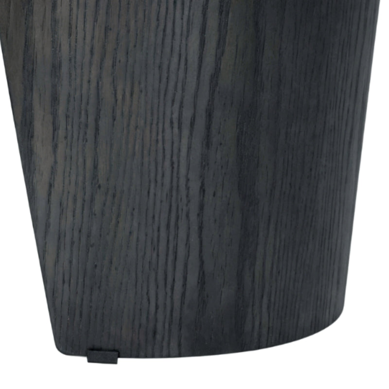 Close-up of a dark charcoal gray wood-grain cylindrical product, showing the wood texture and a small black tab at the base, on a white background.