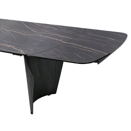 A modern rectangular dining table with a dark black marble top featuring subtle warm beige veining and a sculptural dark wood pedestal base, shown on a solid white background.