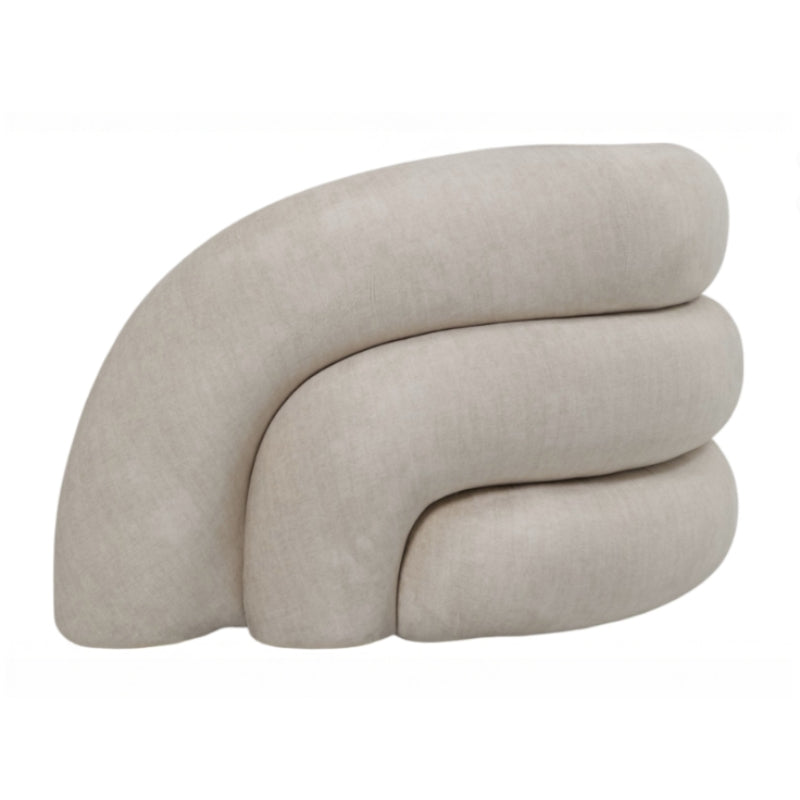 A modern curved upholstered ottoman or low stool in a light beige fabric, shown against a plain white background.