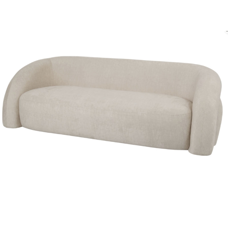 A modern curved three-seater sofa upholstered in a textured cream-beige fabric, shown from a three-quarters angle against a plain white background.