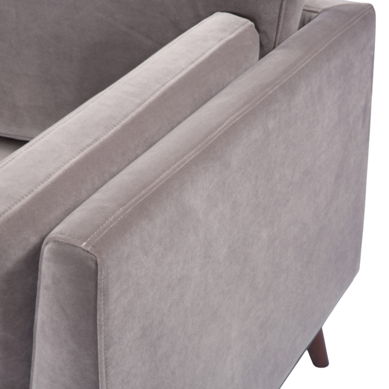 Gray sofa with a focus on the armrest and backrest on a white background
