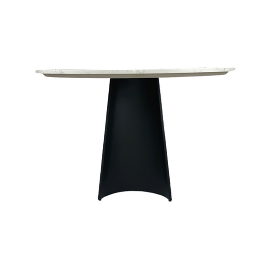 Round table with a white marble top and black base on a white background
