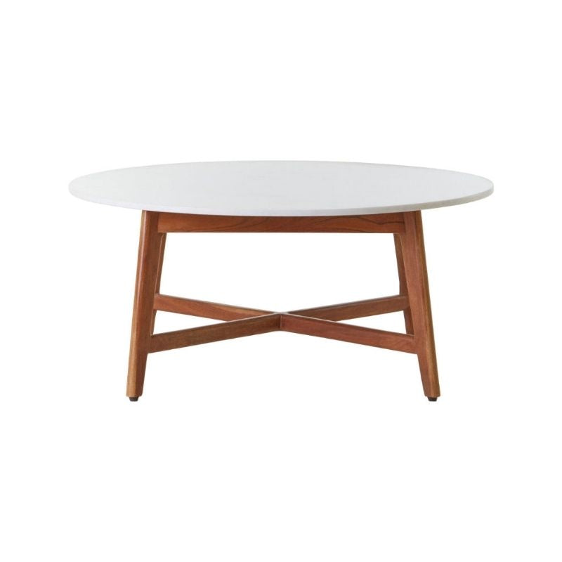 Round coffee table with white top and wooden legs on a white background