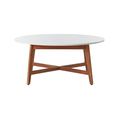 Round coffee table with white top and wooden legs on a white background