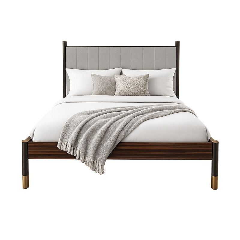 Wooden bed with gray upholstered headboard and white bedding on a white background