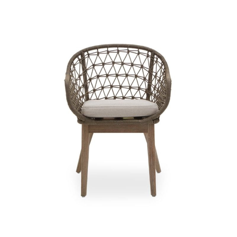 Wicker chair with a cushion on a white background