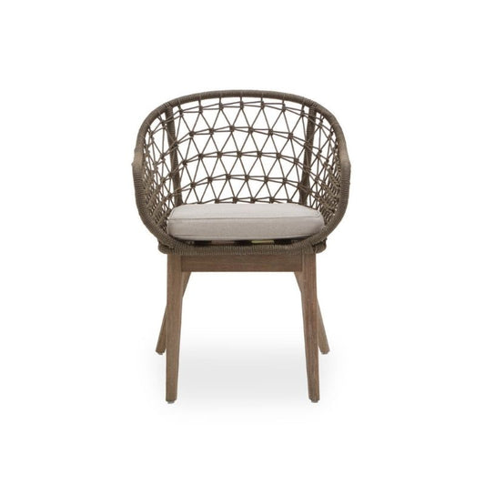 Wicker chair with a cushion on a white background