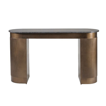Modern dining table with bronze base and marble top on a white background