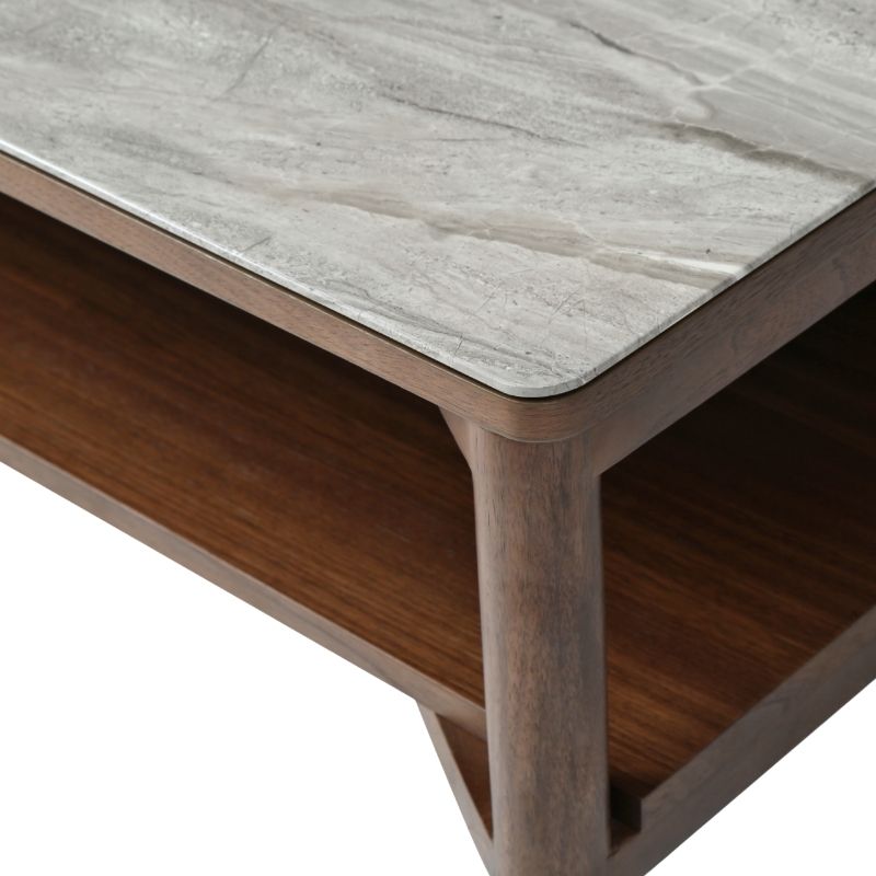 Wooden coffee table with a marble-like top on a white background